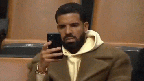 drake-phone-drake-mad-looking-at-phone.gif